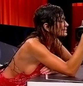 Daniela Cardone busty sideboob in a red dress
